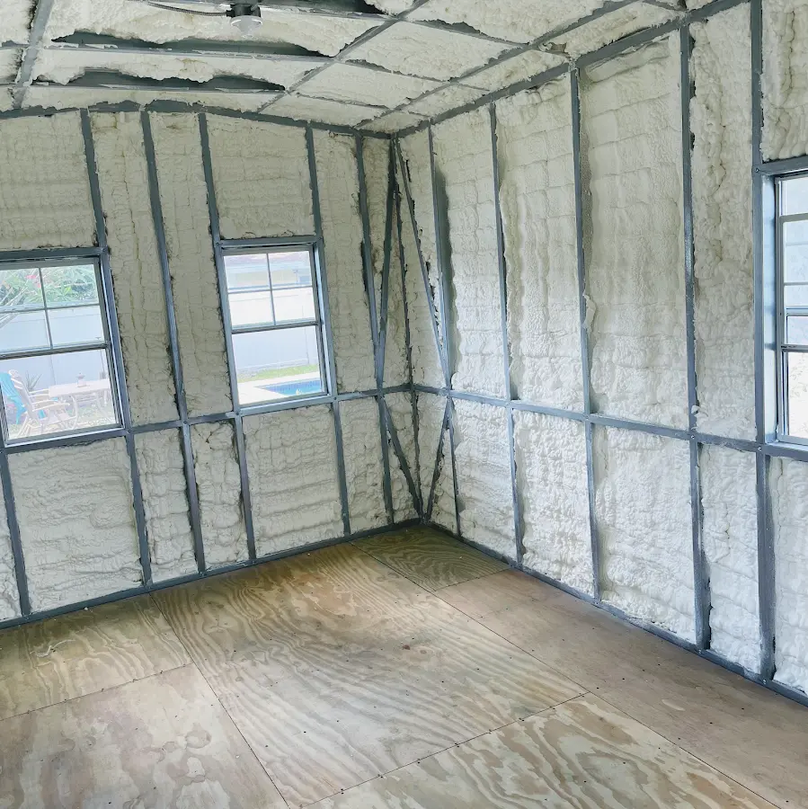 Closed-cell spray foam insulation applied to wall cavities in a residential project in Stafford